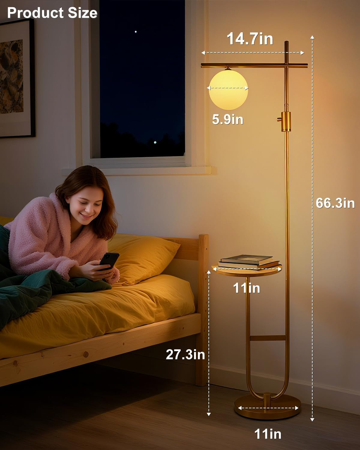 Gold floor lamp with dimensions shown next to a person using a phone on a bed.