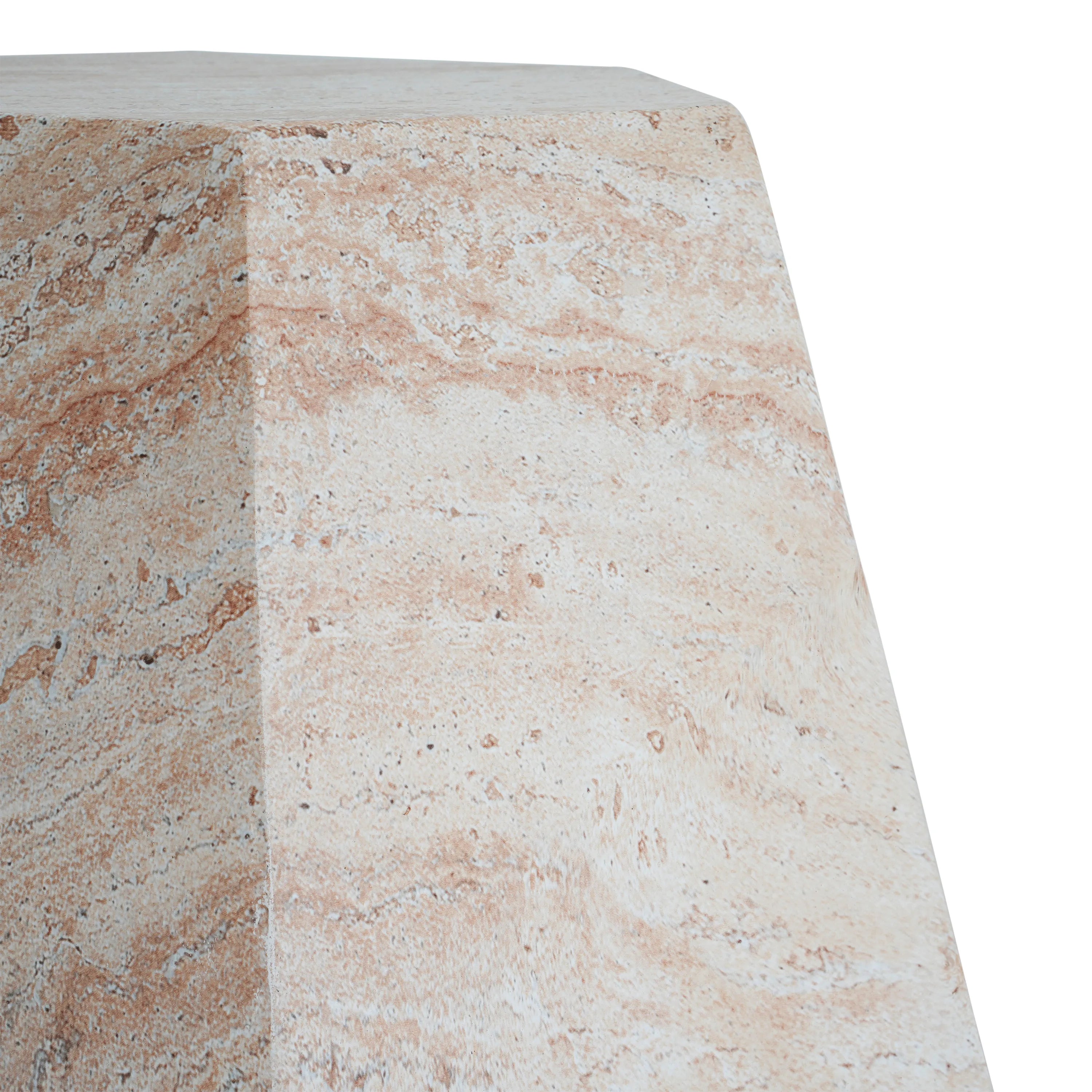 Close-up of a beige travertine marble-patterned side table on a white background