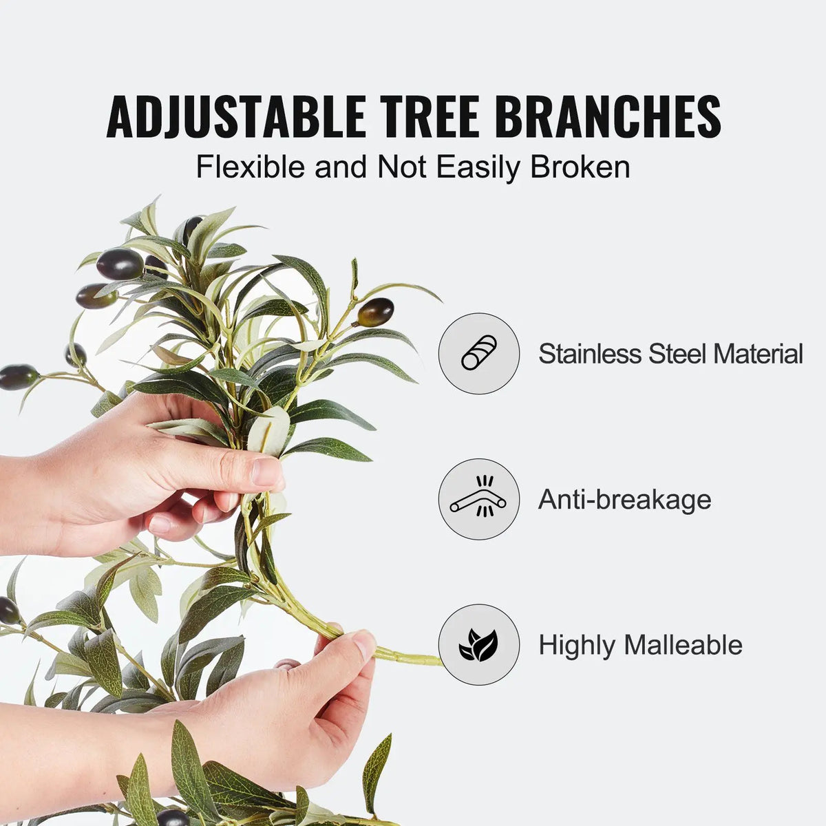 Adjustable artificial olive tree branches with a hand holding them, featuring stainless steel material, anti-breakage, and high malleability on a white background.