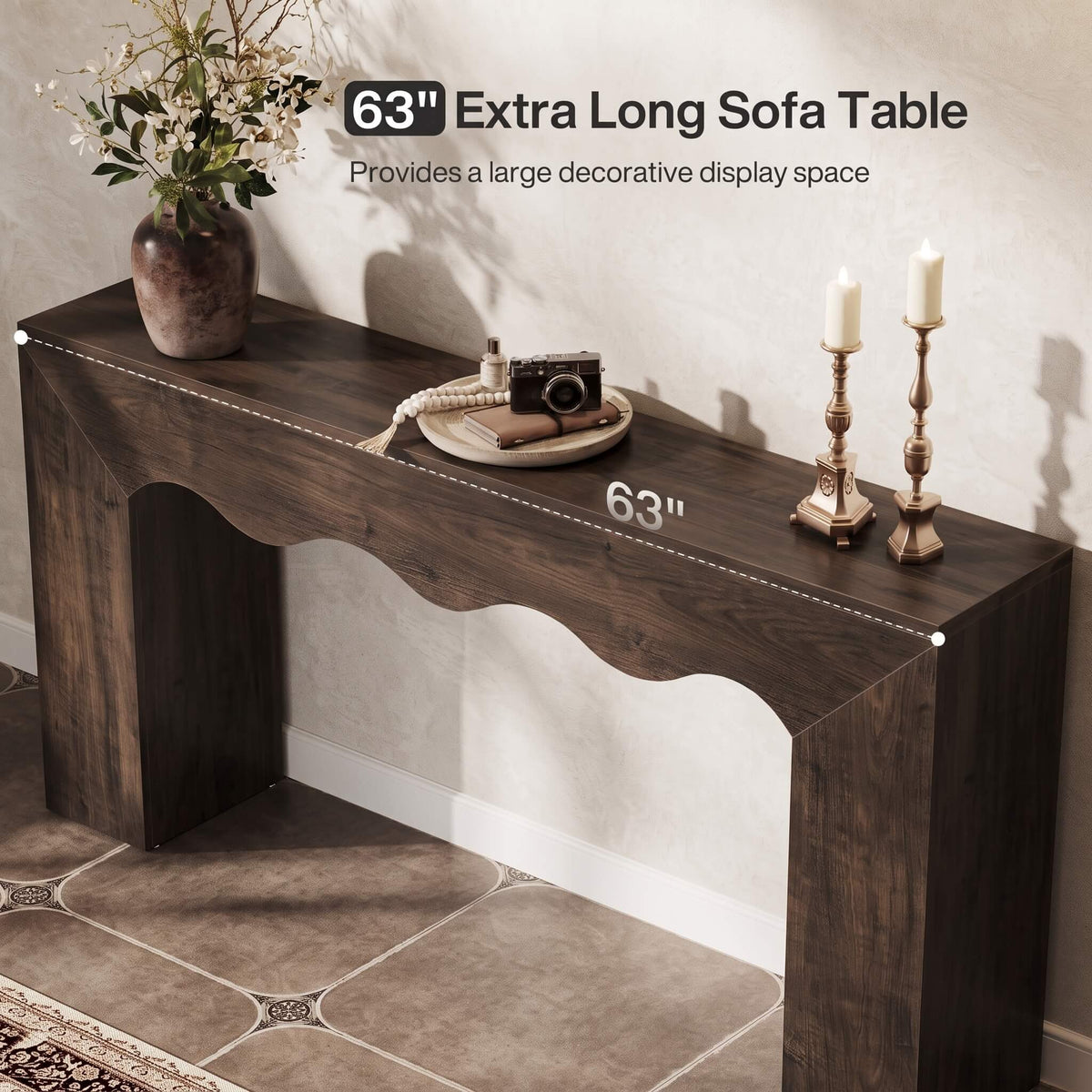 A dark brown 63-inch console sofa table shown in a styled room setting with decorative props, featuring text overlays indicating its length and decorative display space.
