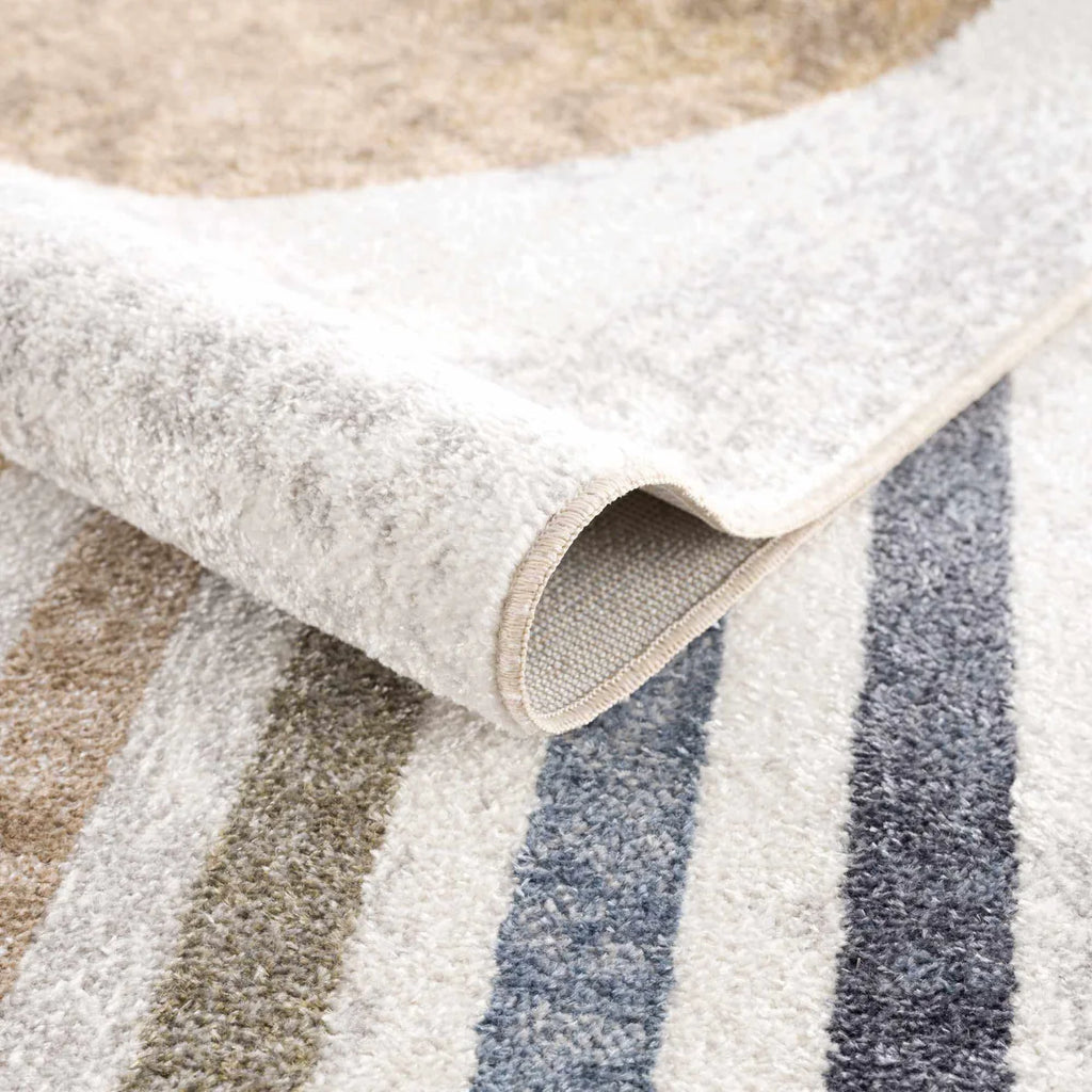 Close-up of a the Giza Contemporary Washable Multicolor Rainbow Rug neutral color palette