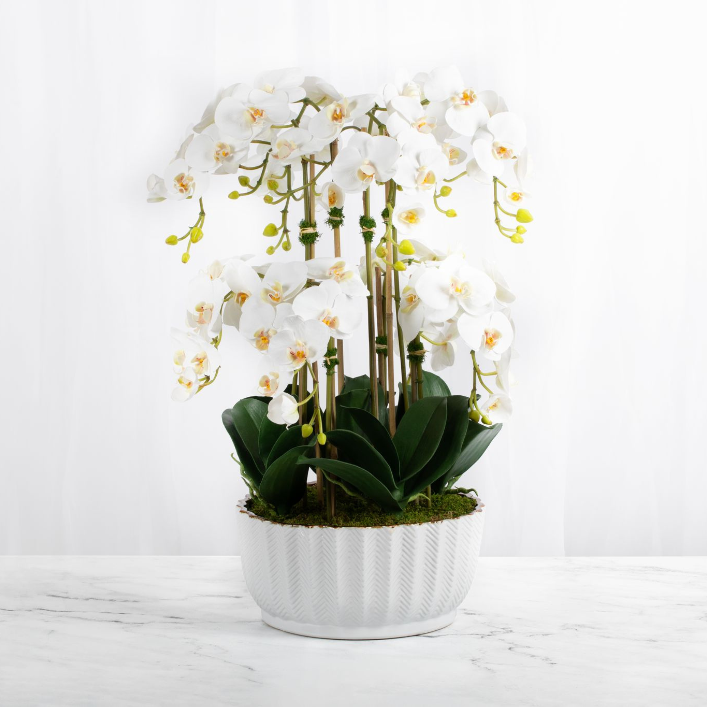 Faux orchid centerpiece in white vase-0