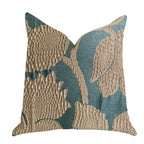 Decorative pillow with textured teal green and gold leaf pattern on a white background