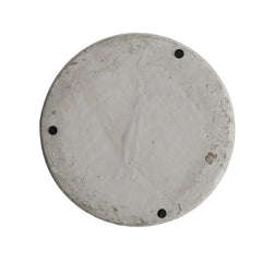 Round concrete disc with three surface protectors on a white background
