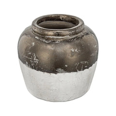 A decorative ceramic vase with a distressed two-tone finish, featuring a metallic bronze upper half and a textured off-white lower half, set against a plain white background.