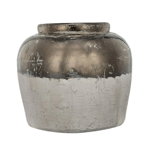 Decorative vase with a metallic finish on a white background
