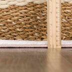 Rug with a wooden ruler for scale on a blurred background