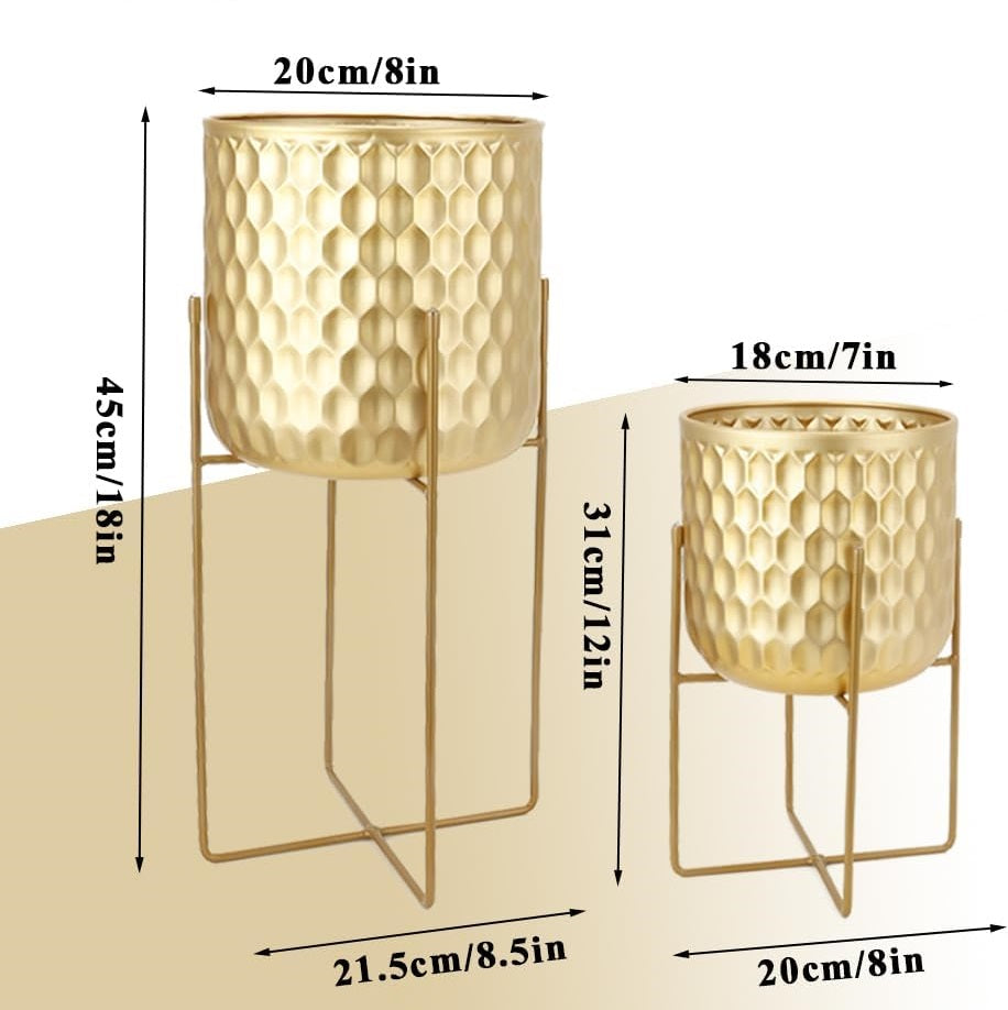 Two gold-colored hammered metal planters with matching wire stands, shown with dimension labels indicating height and width in centimeters and inches.